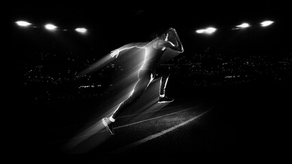 Running sprinter with speed light trail motion effect on stadium track for athletics advertising, sports promotion and performance training campaigns. © master1305