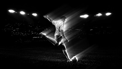 Soccer player striking ball with dramatic light trail motion effect in stadium used for football advertising, sports promotion and athletic performance campaigns. © master1305