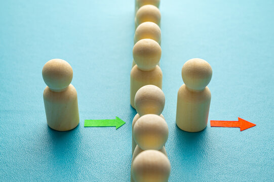 Concept of staff turnover, hiring, and firing, in a company, expressed with wooden pawns.
