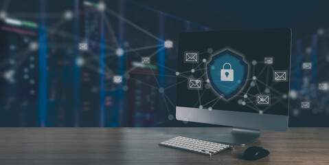 Mail server security and encrypted email network concept desktop monitor with shield lock of data center servers, email cybersecurity protection.
