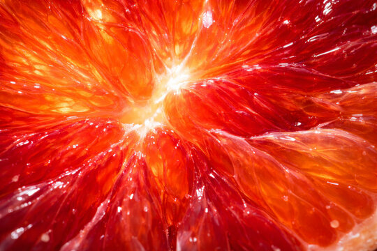 Close-up of vibrant blood orange slice revealing juicy texture