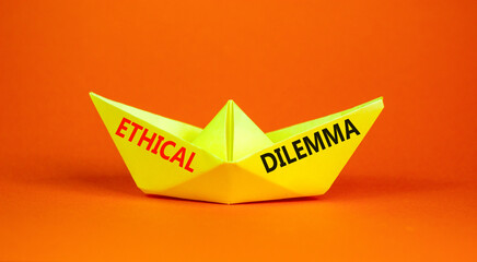 Fototapeta na wymiar Ethical dilemma words symbol. Concept words Ethical dilemma on beautiful yellow paper boat. Beautiful orange background. Business and Ethical dilemma words concept. Copy space.
