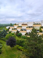 Obraz premium Modern terraced residential buildings with green gardens in Prague suburb, Czech Republic