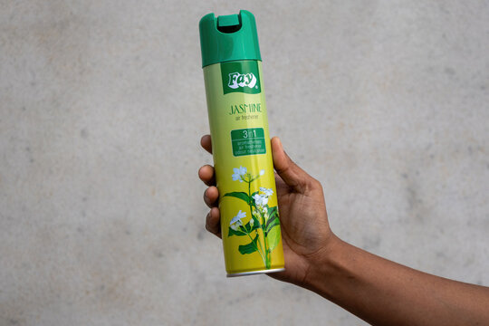 Kishoreganj, Bangladesh - 02 March, 2026 - A person holding Fay Jasmine air freshener 300ml spray bottle outdoors. Fay is a popular consumer brand in South Asia providing home fragrance solutions