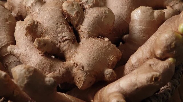 Fresh ginger in a wooden plate.	