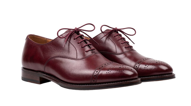Elegant pair of polished brown leather oxford shoes with brogue detailing and red laces, perfectly isolated PNG for fashion and footwear design