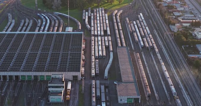 Aerial view of a train depot with multiple trains parked on parallel tracks, displaying a complex network of railway lines, Rome, Lazio, Italy.