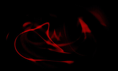 Fototapeta premium Abstract red swirling patterns on black background