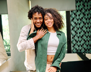 Obraz premium Portrait of a lovely young couple together, bonding hugging and relaxing at home
