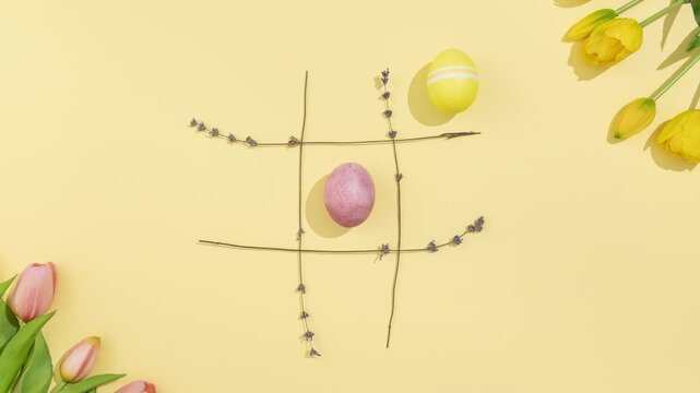Easter Eggs Tic Tac Toe Stop Motion on Yellow Background 4K