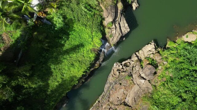Hidden Pantihan Falls flowing inside dense tropical rainforest in Maragondon Cavite Philippines.
