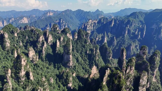 Iconic sandstone pillars in National Forest of Yuanjiajie Zhangjiajie China, aerial panoramic view