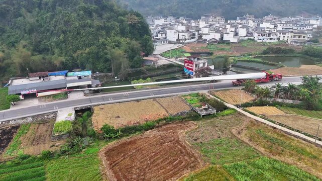  Dawn Transport: Wind Turbine Blade on Rural Road, China
