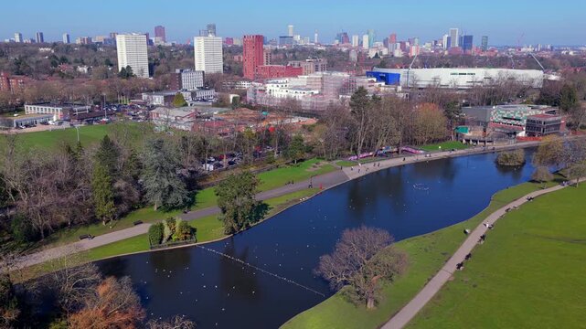 Aerial video of Cannon Hill Park boating lake and Birmingham skyline.
