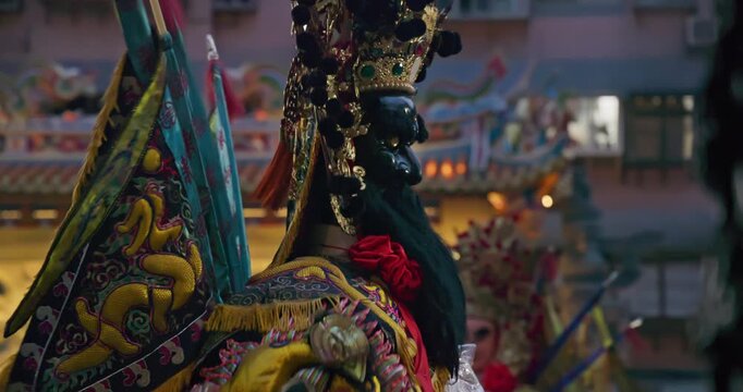 New Taipei City, Taiwan, May 12, 2025: A magnificent procession of deities at a temple fair, including the "Great Immortal Husbands" troupe. The lifelike deities move through the crowds in front of th
