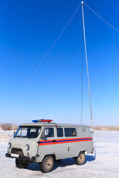 Resque car in work winter on blue sky