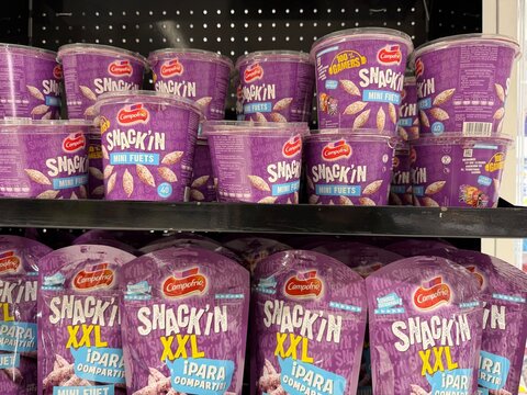 Mallorca, spain, february 20, 2026, campofrio snackin mini fuets and xxl snacks in purple packaging lining a grocery store shelf, marketing food products