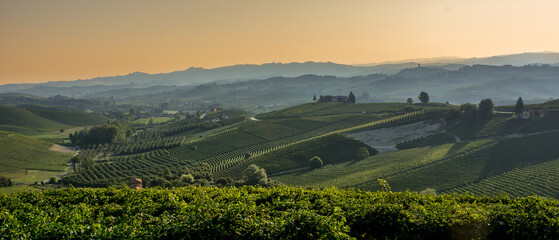 Naklejka premium Beautiful view italian village morning fog Italy summer