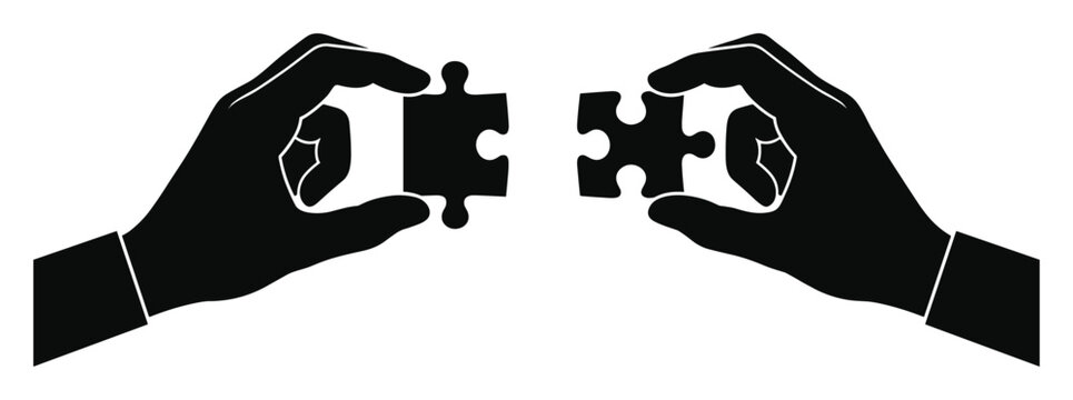 Black silhouette of two hands holding puzzle pieces, symbolizing connection and problem-solving collaboration