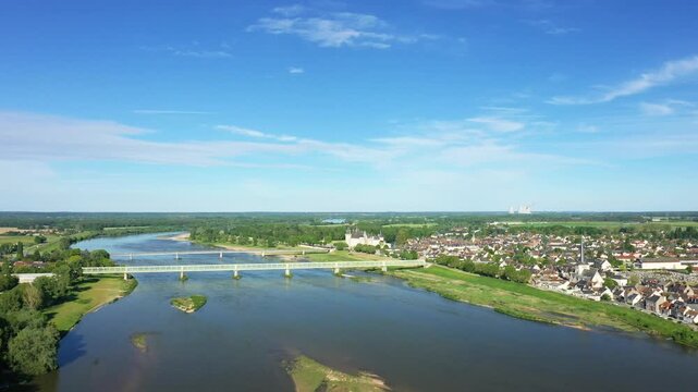 Scenic aerial shot of Sully sur Loire with the Loire River, bridges, and surrounding countryside under a clear blue sky.