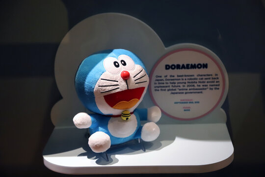 Doraemon plush toy display with copy space and blurred background