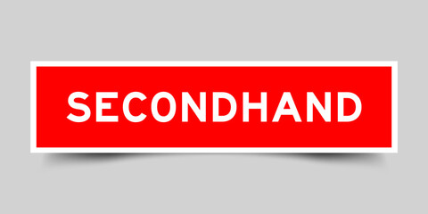 Red color square shape sticker label with word secondhand on gray background