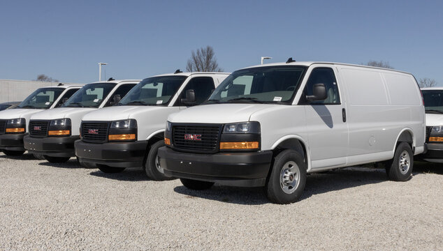 GMC Savana 2500 Cargo Van display at a dealership. GMC offers the Savana 2500 with a 4.3L V6 engine. MY:2025