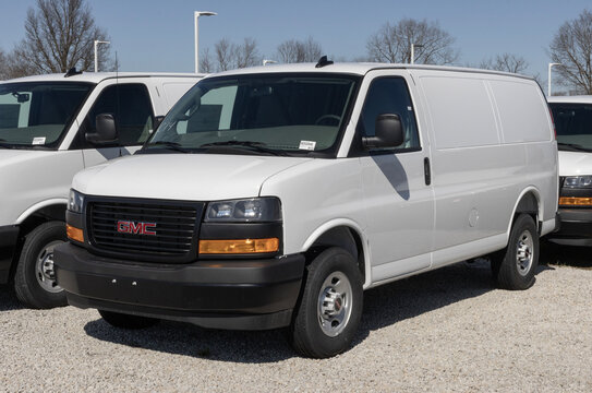 GMC Savana 2500 Cargo Van display at a dealership. GMC offers the Savana 2500 with a 4.3L V6 engine. MY:2025