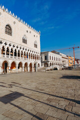 Venice square with historic buildings and blue sky during daylight hours