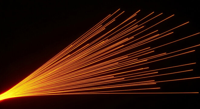 Radiant orange lines converge from a point on a black background, suggesting movement, direction, and energy, perfect for technological concepts