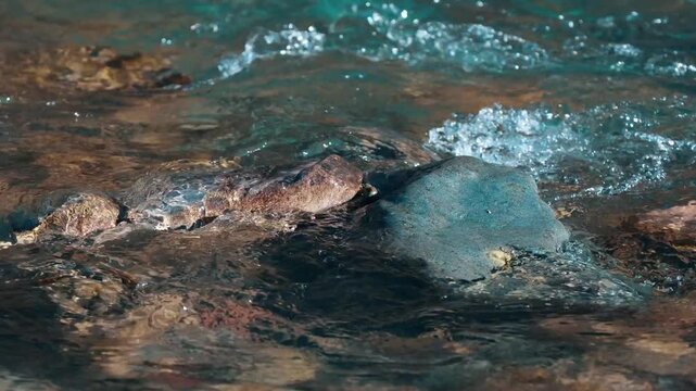 Clear River Water Flowing Over Natural Stones &ndash; Close-Up Nature Scene