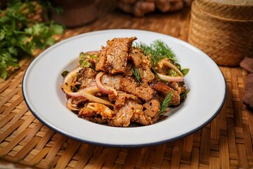 Traditional Thai Spicy Grilled Pork Salad (Nam Tok Moo) with Sticky Rice