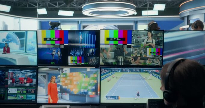 TV Station Control Room Runs a Live News Broadcast, Coordinating Camera Shots, Studio Filming, Monitoring Multiple Feeds. Professionals Deliver Content for Cable Channel and Streaming Transmission 