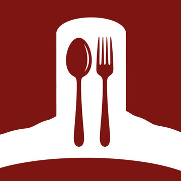 Spoon and fork on white plate.