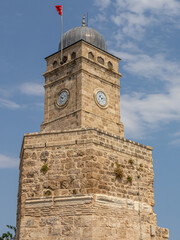 Fototapeta premium The mosque of Tekeli Mehmet Pasha. The city Mosque in Antalya. The old quarters in the Kaleici area. Turkish mosque. The clock on the ancient tower.