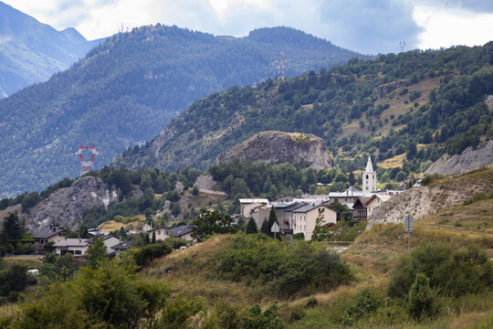 Summer view of the village of Le Bourget, near Modane in in the Maurienne Valley of Savoie, France, and the surrounding landscape of mountains.