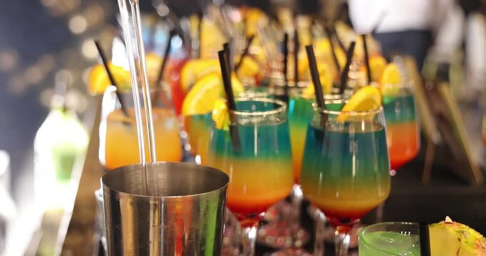 Bartender prepares a colorful Melon Refreshing cocktail at a party, mixing vibrant ingredients to create a refreshing drink that adds energy, fun, and great vibes to the celebration, slow motion