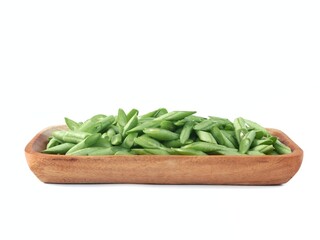 fresh sliced green beans in a wooden bowl isolated on white background. perfect for food...
