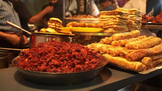 Variety of non vegetarian food dishes at market stall in Mumbai, India