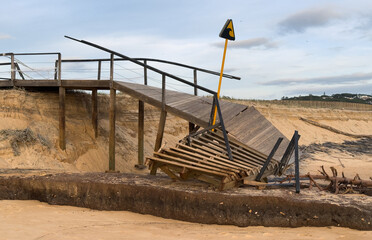 Fototapeta premium Boardwalk to the beach damaged by hurricane Irma striking the east coast 