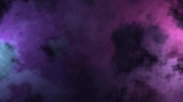 Swirling hues blend with black splotches in a cloudy abstract motion