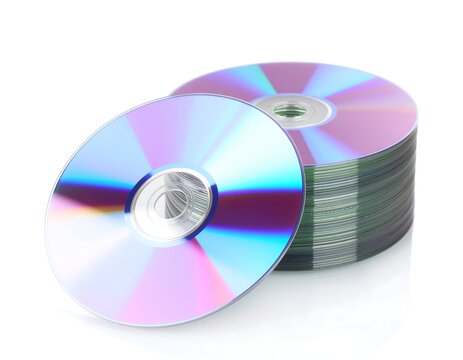 Stack of CDs with one leaning against it on a white background.