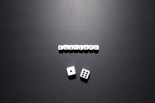 Variance word above dice representing statistical spread, probability differences, and risk analysis.