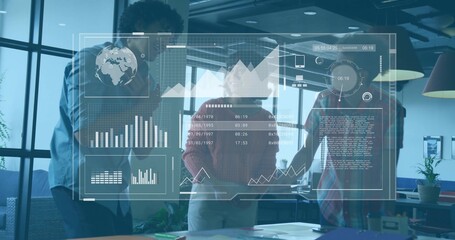 Reviewing three colleagues wearing shirts and sweaters, pointing at projected dashboard in office