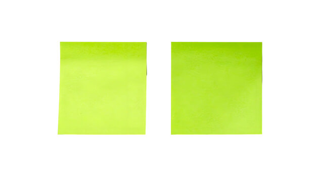 Two bright green sticky notes sit side by side against a stark black background