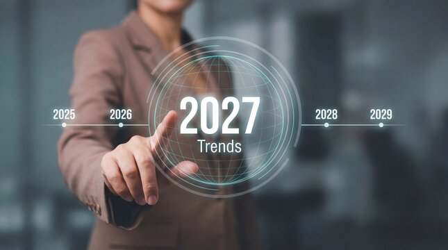 Businesswoman hand touches futuristic holographic interface displaying 2027 Trends with timeline showing years 2025 through 2029