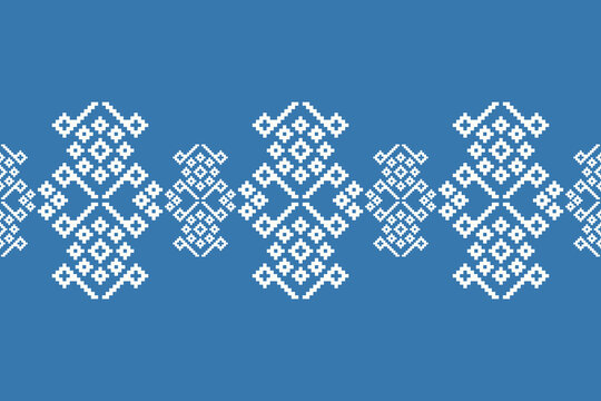 Ethnic pattern blue background embroidery motif traditional with geometric,fabric pattern,colorful,tribal,cross stitch,ikat.