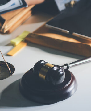 Businesswoman and Male lawyer or judge consult and conference having team meeting with client at law firm in office, Law and Legal services concept