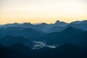 Obraz premium Spectacular Summer Sunrise from a Mountain Peak, Panoramic View over Jagged Alpine Ranges in Golden Morning Light