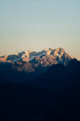Obraz premium Spectacular Summer Sunrise from a Mountain Peak, Panoramic View over Jagged Alpine Ranges in Golden Morning Light